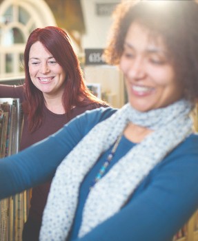 Two women looking for a book Two women looking for a book