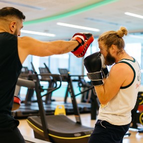 Two people boxing in a gym Two people boxing in a gym