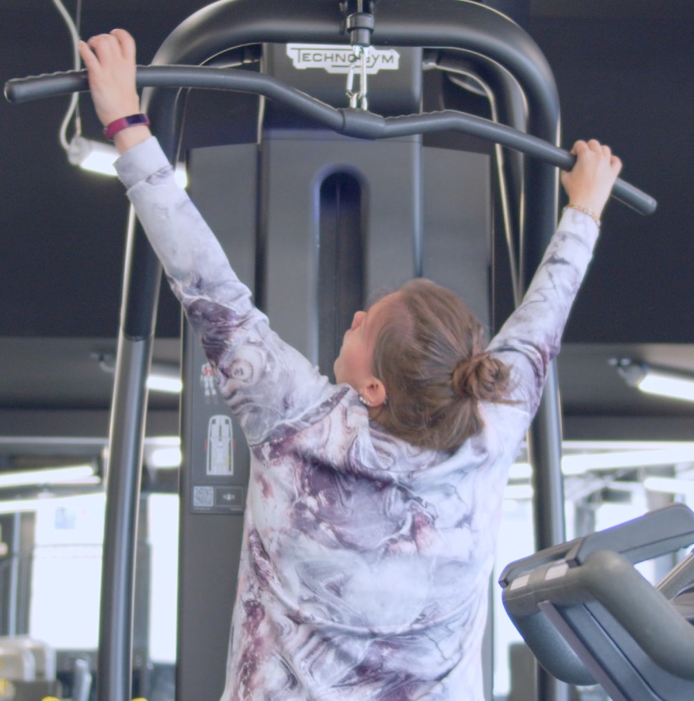 Mari using a weight machine Mari using a weight machine