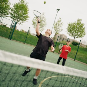 Boys playing tennis