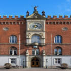 A Brick Building with a Clockface in Odense