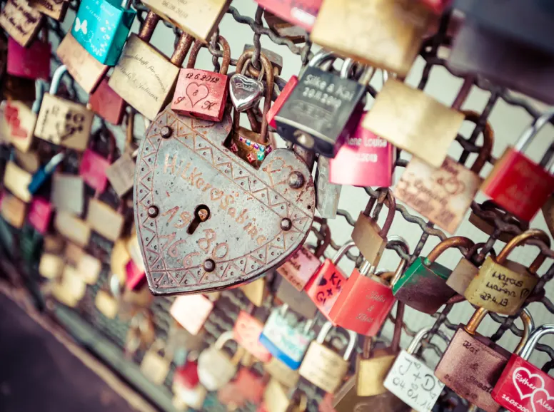 Locks Chained to a Bridge in the Shape of a Heart