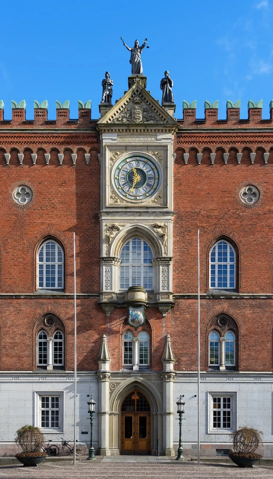 A Brick Building with a Clockface in Odense