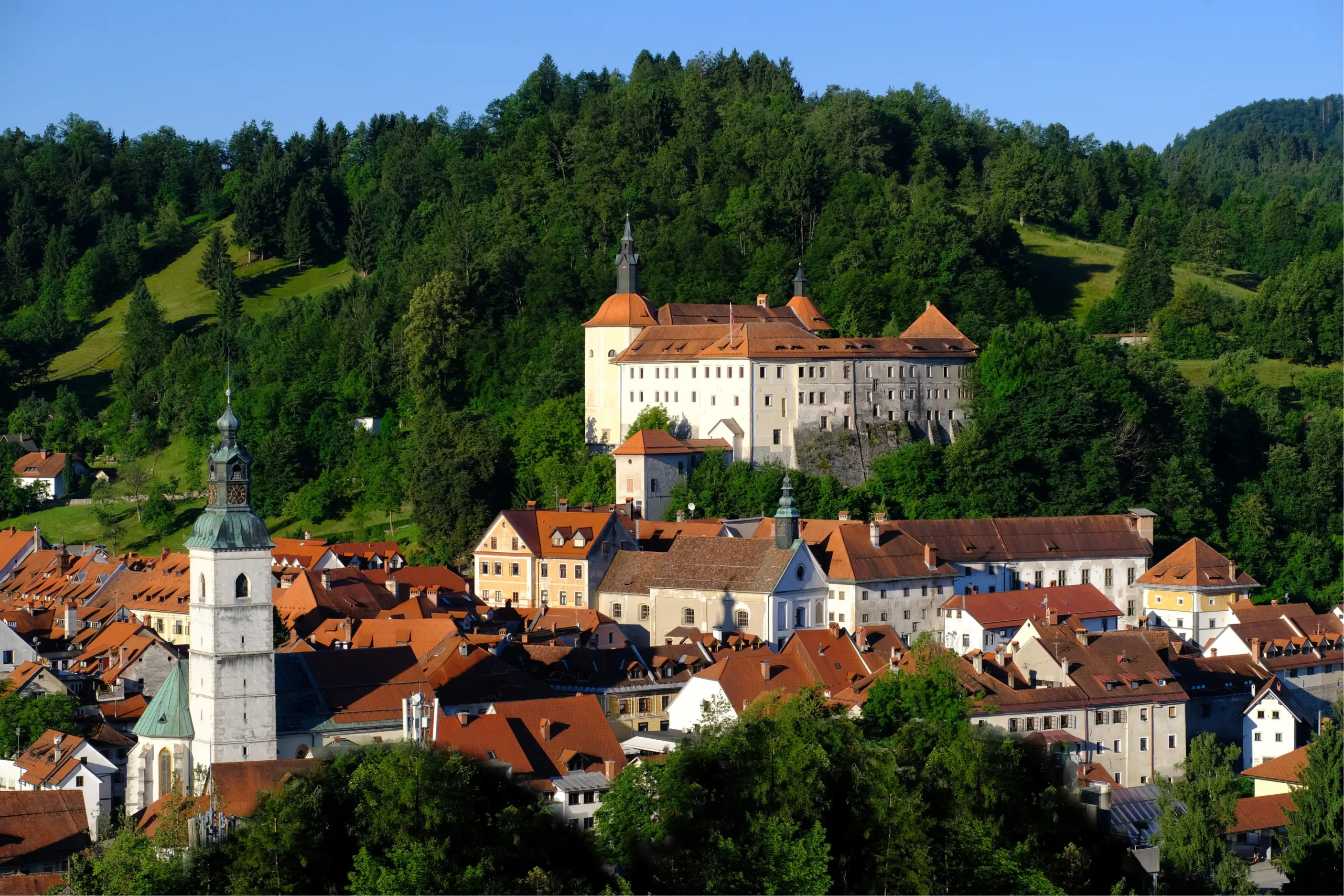 A Village with White and Orange buildings on a Hillside