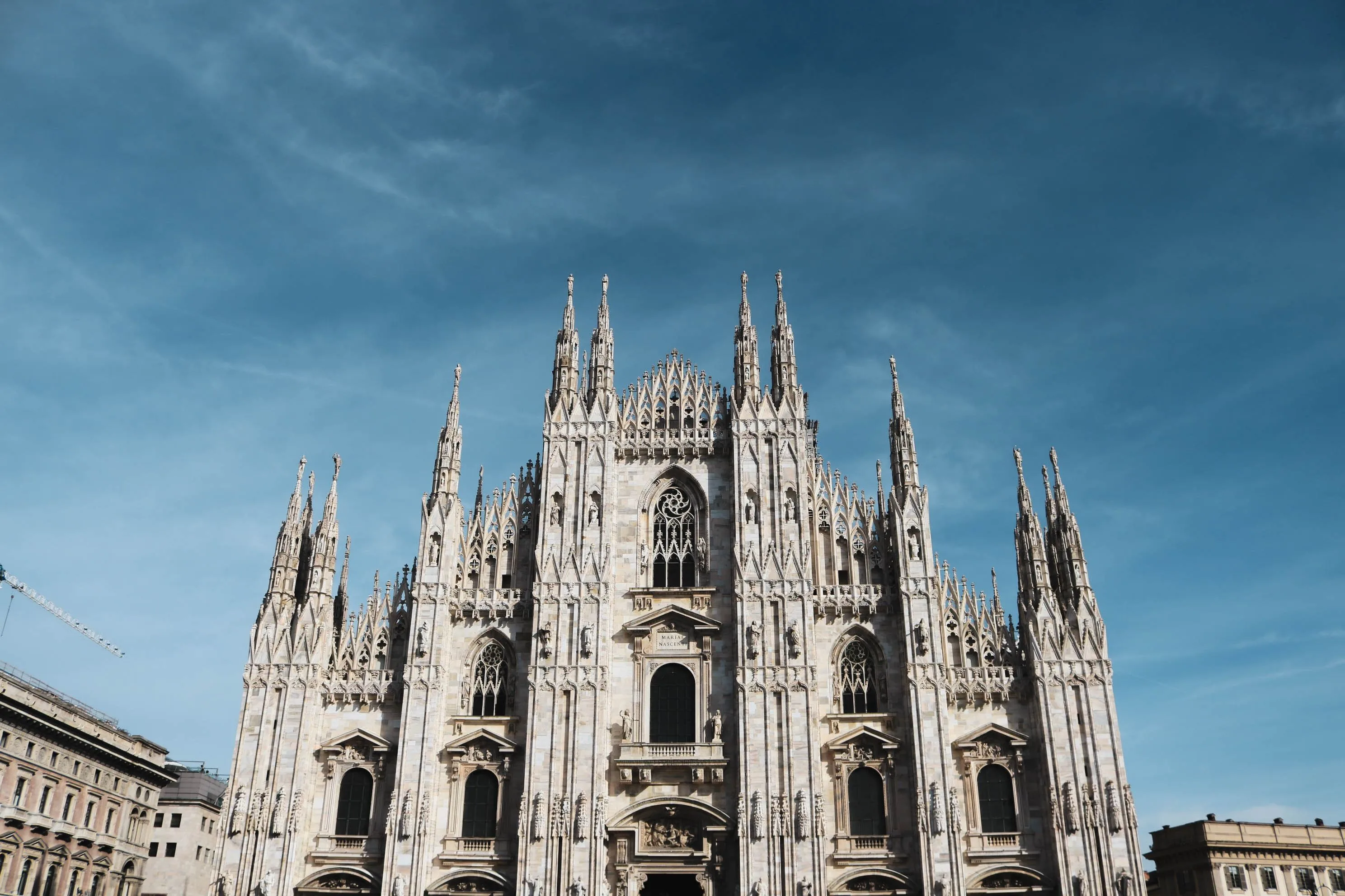 A white gray cathedral with gothic spires