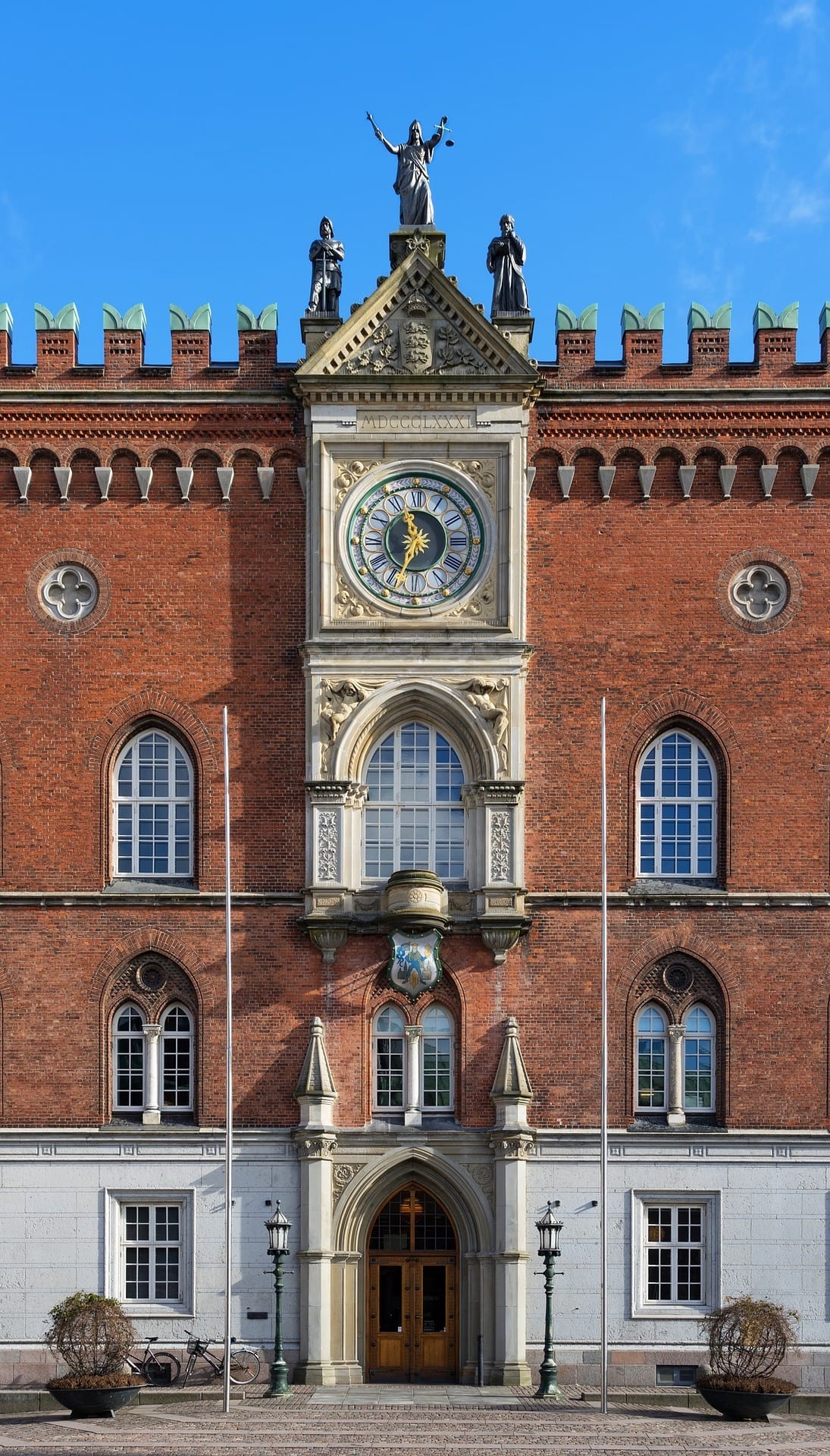 A Brick Building with a Clockface in Odense