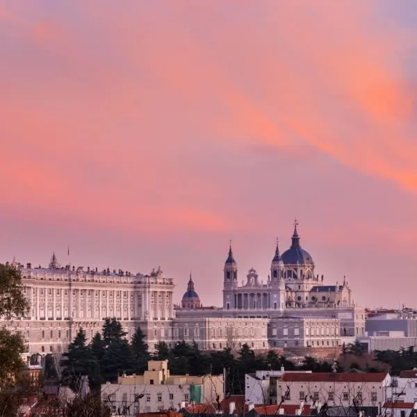 The Madrid Royal Palace glows at dusk