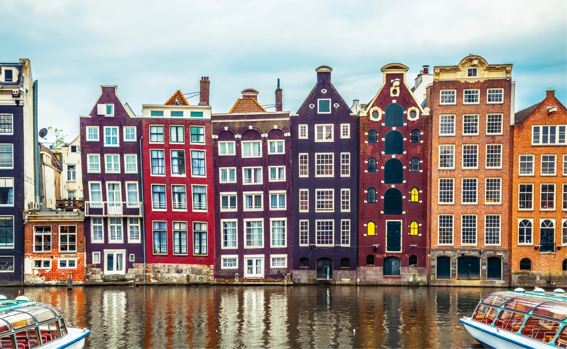 A Row of Colorful Gable Houses by a Canal