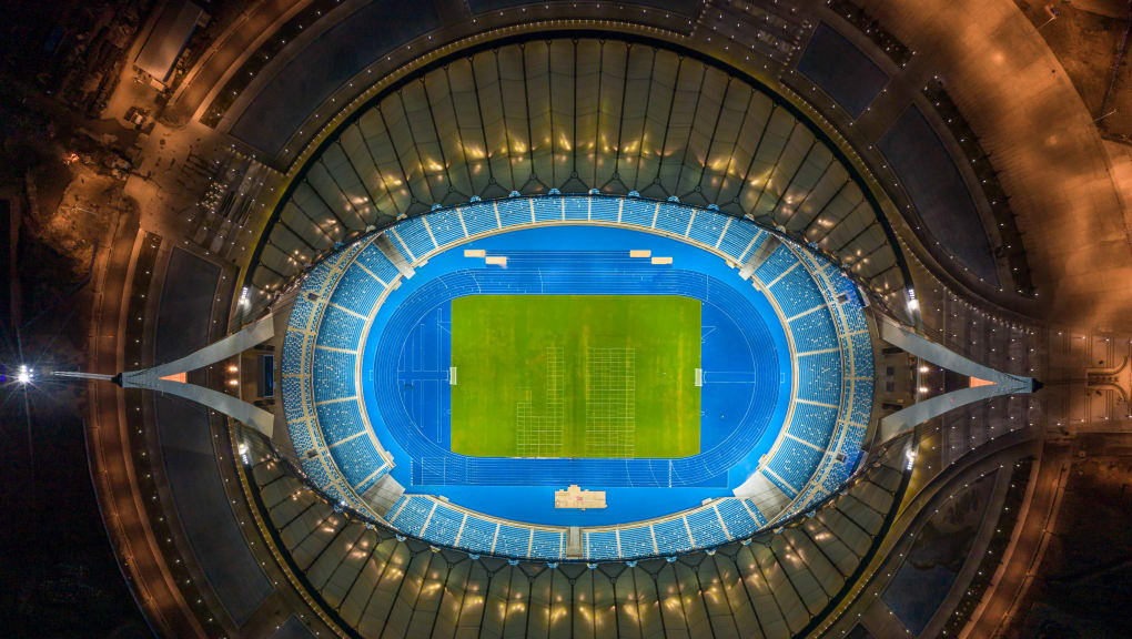 Aerial view at night of Morodok Techo National Stadium