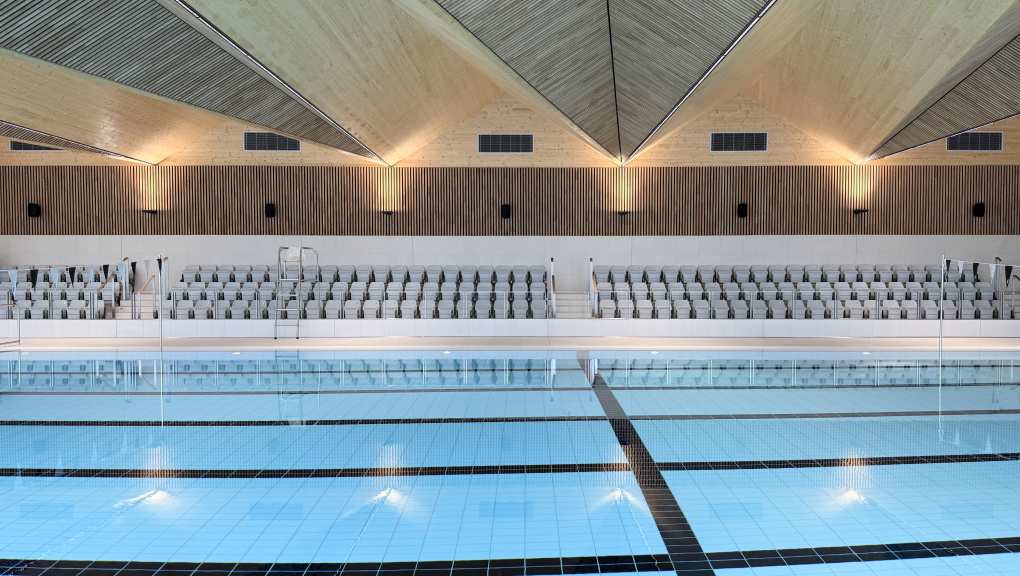 Side view over the pool. Copyright: Design Engine Architects, 2026.
