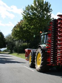 Kverneland F35 compact travelling on road with tractor