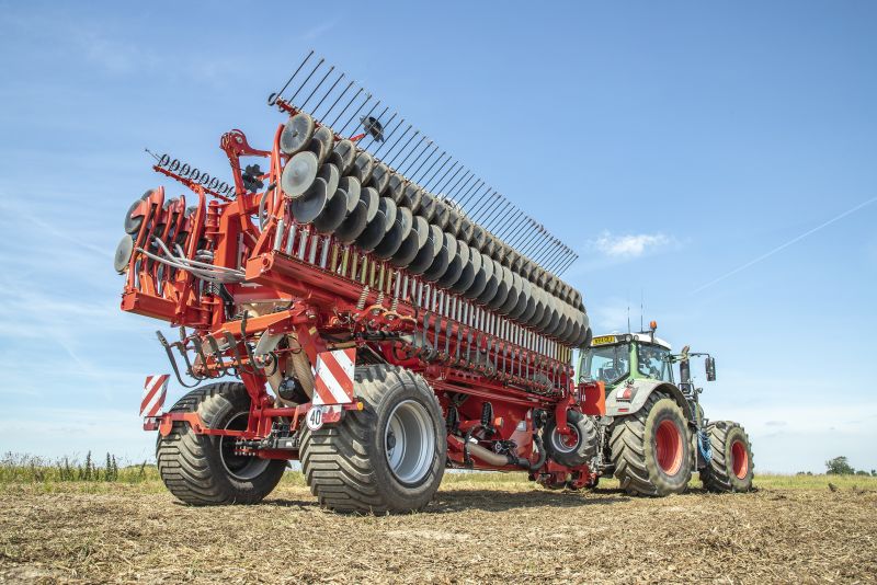 Kverneland DG2 compact transported by tractor on road