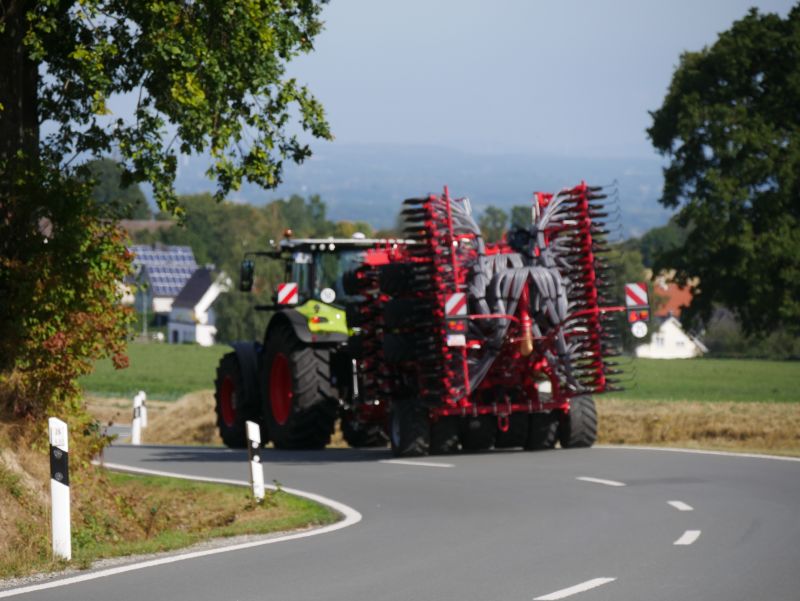 Kverneland U-drill, transported on road by tractor