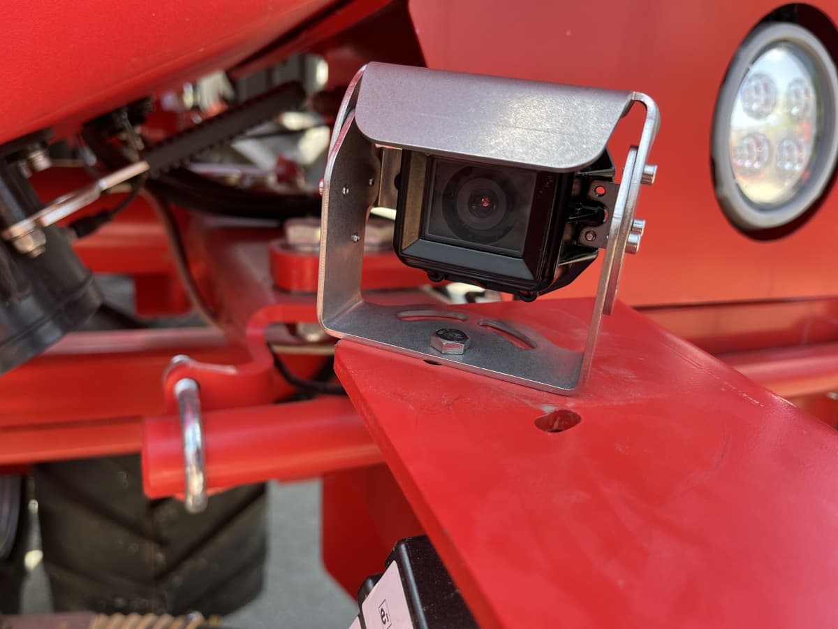 Rear-view camera on a red Kverneland implement for precision farming