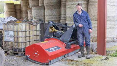 Farmer David McKie standing in front of his Kverneland FRO Flail Chopper
