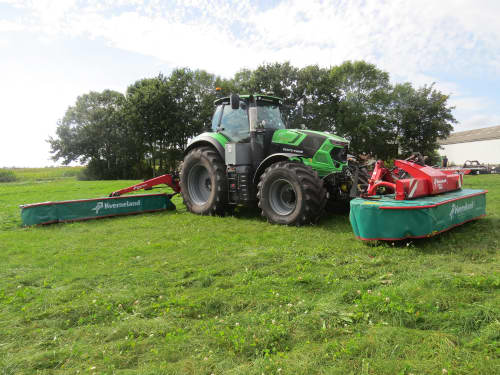 Kverneland 5095 disc mower with 2832 F front mower cutting grass at Hedegaarden Farm, Denmark