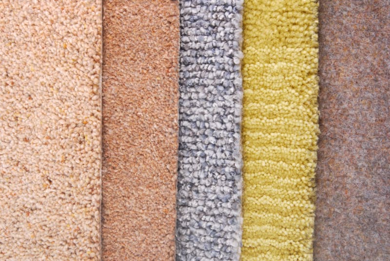 samples of carpet with different textures and colors