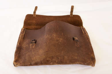 Simple leather satchel used by Joe Lyons throughout his working life from his early years as a teacher in remote Tasmanian schools to his time in State and Federal politics.