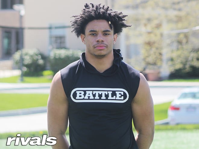 New England athlete Joenel Aguero holds a Michigan Wolverines football recruiting offer from Jim Harbaugh.