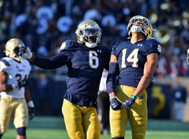 Notre Dame rising senior rover Jeremiah Owusu-Koramoah and rising sophomore safety Kyle Hamilton celebrating