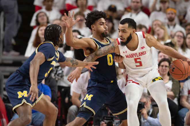 Michigan Wolverines basketball's Zavier Simpson (left) and David DeJulius