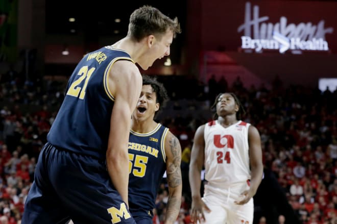 Michigan Wolverines basketball guard Franz Wagner shouting with excitement.