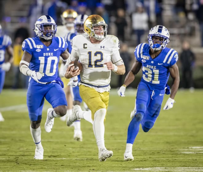 Notre Dame fifth-year senior quarterback Ian Book ripping off a big run at Duke last year