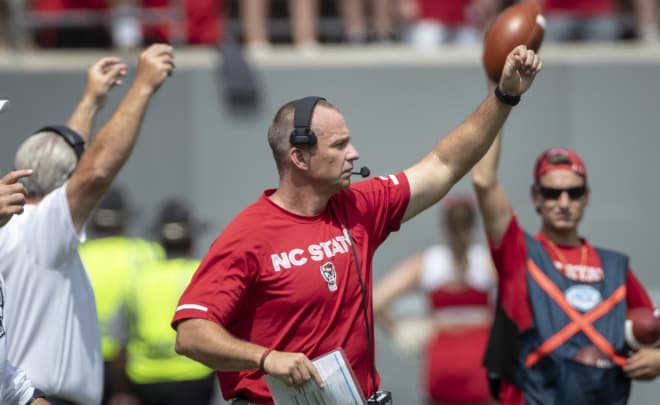 NC State Wolfpack football head coach Dave Doeren coaches on the sideline.