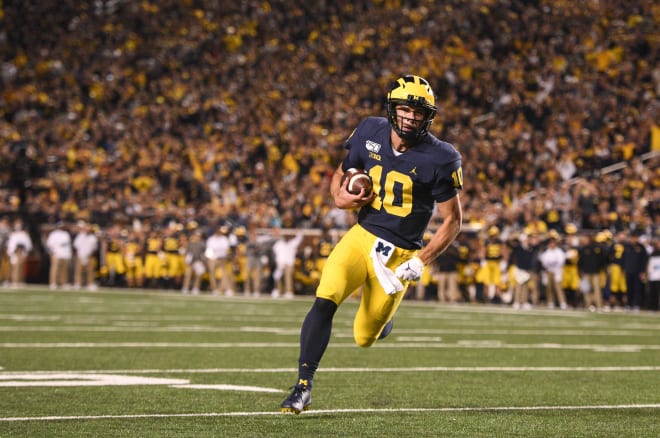 Michigan Wolverines football quarterback Dylan McCaffrey runs 