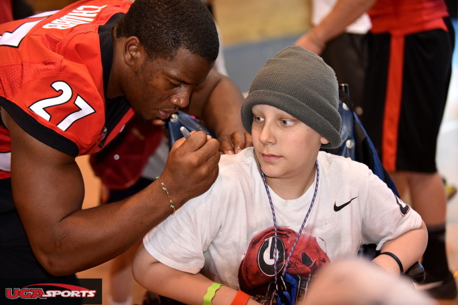 Nick Chubb was asked by this camper, "Do you need my brace?" Chubb smiled and said, "No, I'm good."