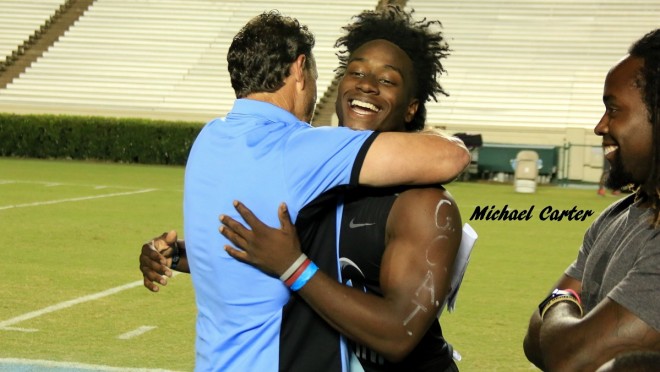 Larry Fedora and 2017 RB commit Michael Carter embrace last month after Carter committed to for the Heels.