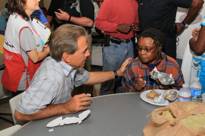 Alabama head coach Nick Saban speaks with a victim of the April 27 tornadoes in the days following the storm.