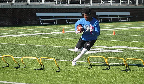 Airport ATH Kerryon Richardson works out at camp.