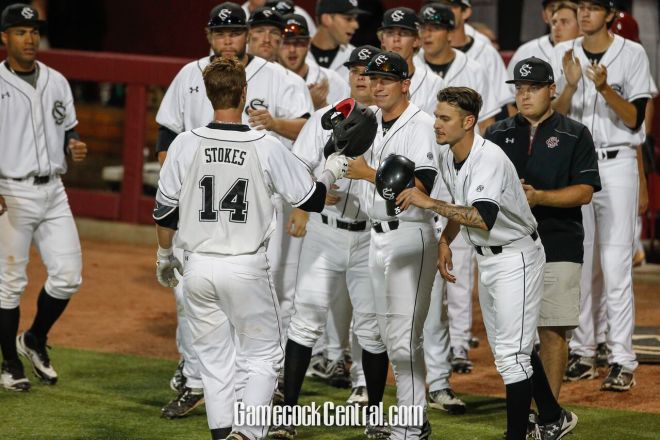 Madison Stokes is greeted by teammates after walloping a solo HR Saturday night 