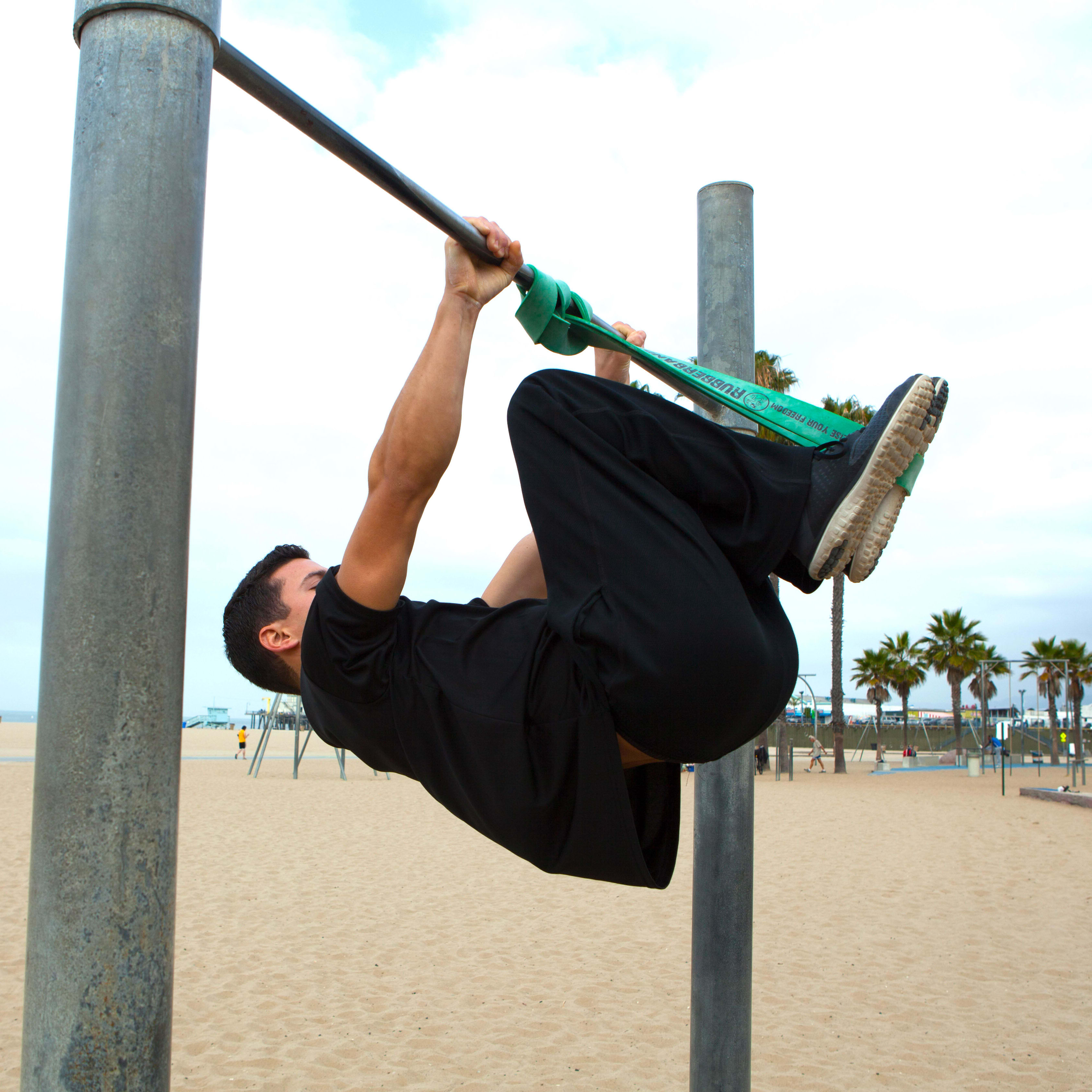 Leg assisted front lever pull-ups on parallel bars - Exercise