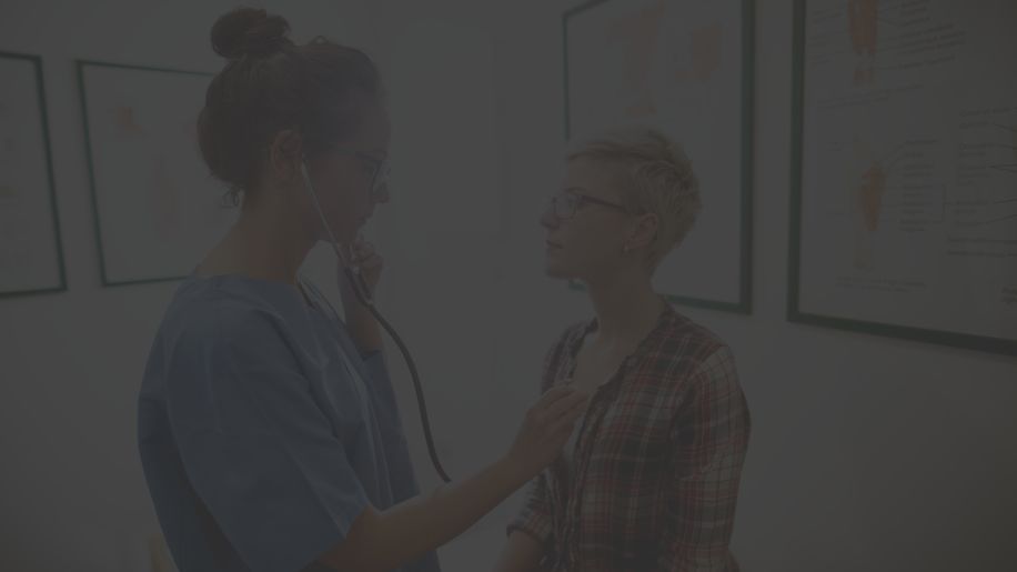 Woman talking to her doctor in his office