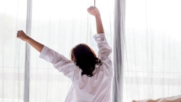 Young asian woman stretching in the morning