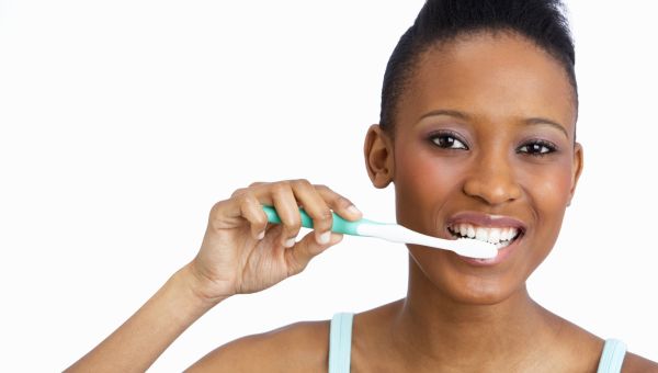 woman brushing teeth