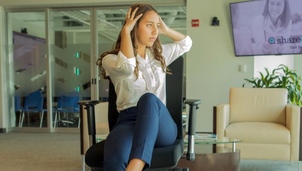 woman stretches crosswise abdomen