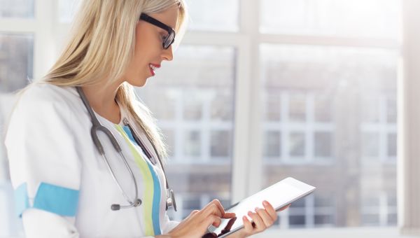 nurse reading patient chart