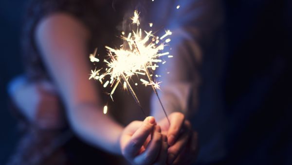 someone holding sparklers