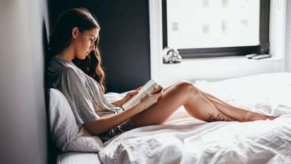 woman, bed, reading, white sheets, book