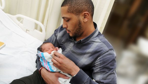 father, newborn, hospital room