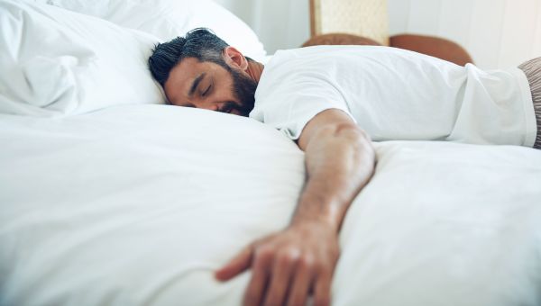 man sleeping in bed