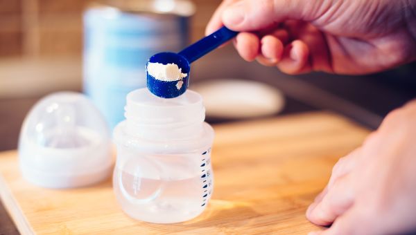 Person mixing baby formula