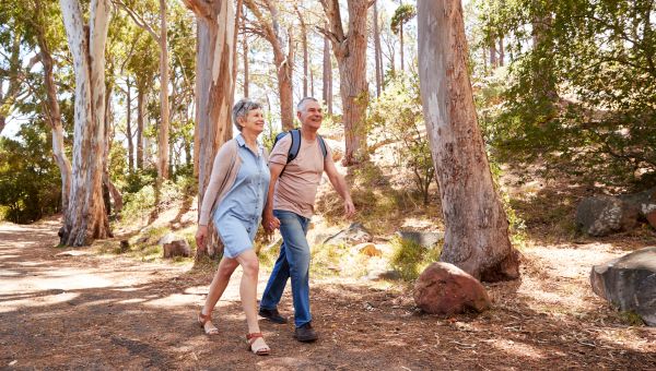 Senior couple walking on trail