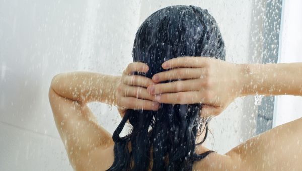 woman washing hair in shower