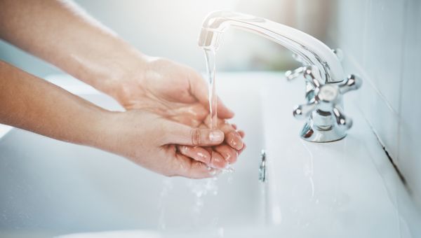 Woman washing her hands