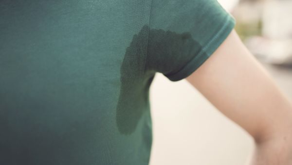 kid with underarm sweat stains