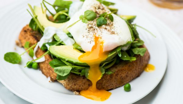 Toast and greens with egg on top